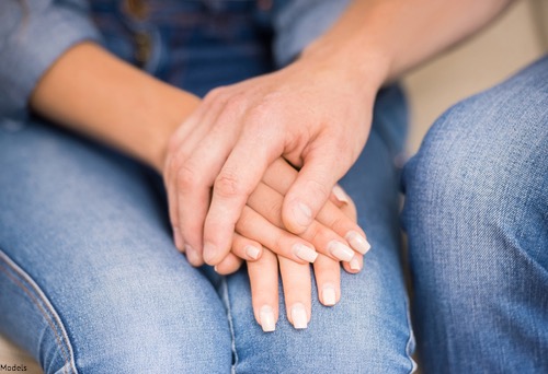 Man and woman holding hands