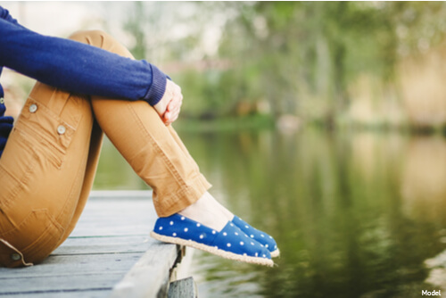 Legs hanging over a dock