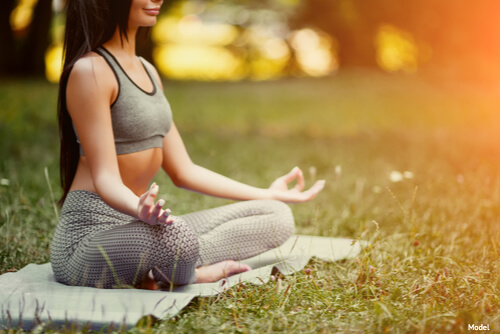 Woman meditating outside