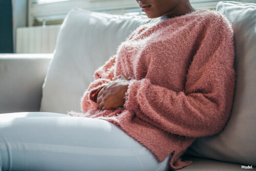 Woman hold her stomach