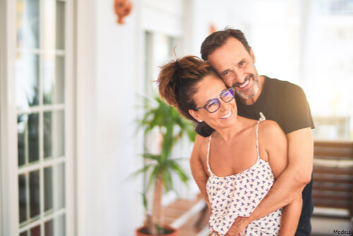 Man hugging woman from behind