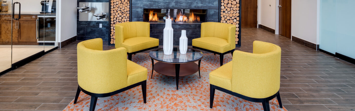 contemporary seating area of medical office with yellow chairs