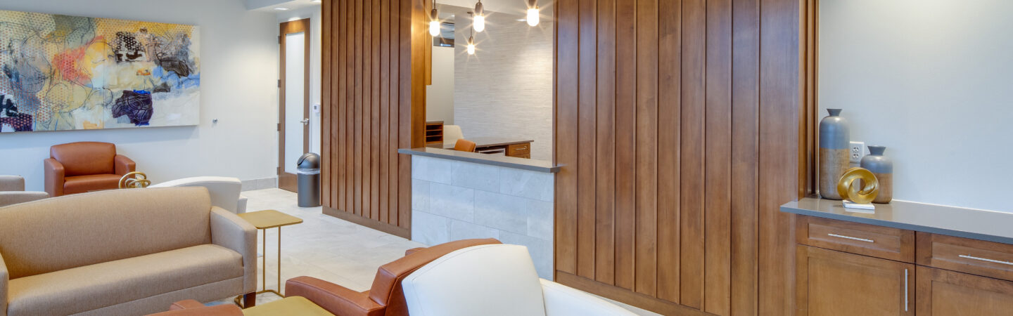 bright waiting area of medical office with wood paneling
