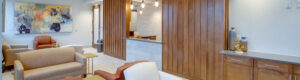 bright waiting area of medical office with wood paneling