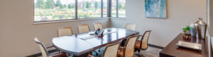 team meeting room with eight chairs around a large table