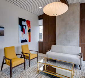 modern contemporary sitting room with yellow chairs